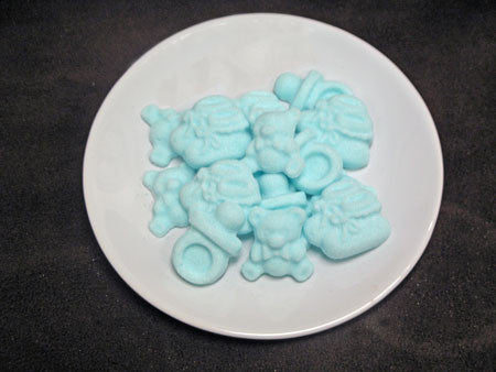 Tea sugars shaped like baby booties, teddy bears, and baby pacifiers