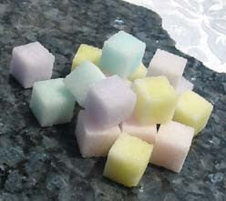 Sugar cubes in pastel shades of purple, pink, yellow, blue, and green