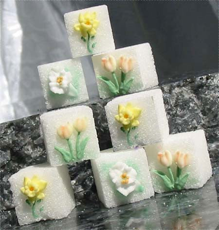 Decorated sugar cubes with liles, tulips, and daffodils